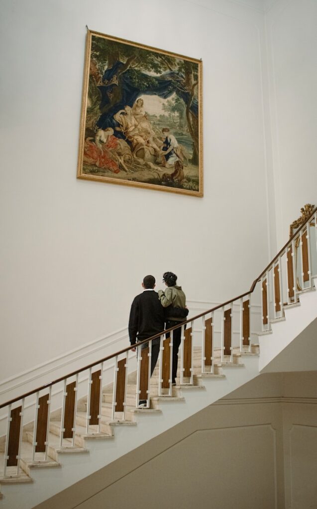 two people walking up a set of stairs